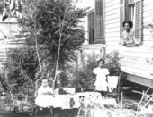 Young girls posed with their toys - Gainesville, Florida.