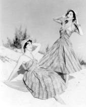 Women modeling fashion at the beach