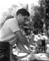 Ross Allen, of Silver Springs, milking a rattlesnake during exhibition at Wakulla Springs