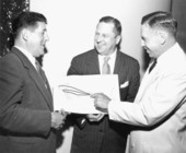 Men representing separate air lines showing new "interchange" deal