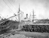 Cargo ship "Old Bull" at dock, awaiting cross-ties and lumber for shipment to Cuba and Panama - Fernandina, Florida