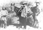 General George Crook, his mule Apache, and two Indian scouts