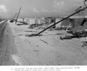 Looking west along Key Colony Drive at Hurricane damaged property