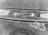 Aerial view of the Sunshine State Parkway (Florida Turnpike), showing one of seven rest area "service plazas" under construction