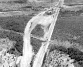 Aerial view of the Sunshine State Parkway (Florida Turnpike), showing the Pompano Beach "service plaza" under construction - Pompano Beach Region, Florida.