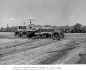 Road grader at work preparing ground for the Pompano Beach "service plaza," on the Sunshine State Parkway (Florida Turnpike) - Pompano Beach Region, Florida.