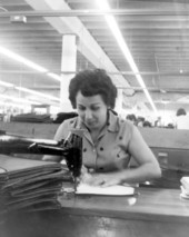 Female employee sewing for J.R. Handbags - Hialeah, Florida