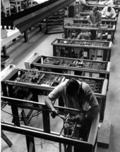 Milgo Electronic Corp. technicians working on computer production line - Miami, Florida