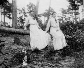 Myrta Maxon and friend sitting on a fallen tree - Saint Andrews, Florida