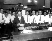 Postmaster J. D. Gardner, in the cancellation department of the post office, sending the first airmail letters to leave Miami - Miami, Florida.