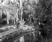 Men filming a woman in a canoe on the Homosassa River