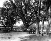 People gathered in front of the Floridatown Hotel - Floridatown, Florida.