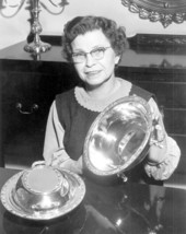 Nettie Moore showing a set of silverware at her home - Tallahassee, Florida.
