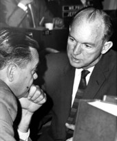 Representatives John J. Crews (left) and J.J. Griffin discussing a proposed spending bill on the House floor - Tallahassee, Florida.
