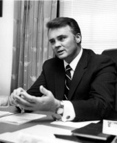 Congressman C.W. "Bill" Young sitting at desk and having a conversation