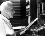 Stanley Fuller, Lepidoptera curator for the Entomology Section, examining some butterflies