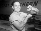 Unidentified man holding up a hat - Jacksonville, Florida.