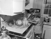 Unidentified children washing dishes at George Brunette's School of Art - Jacksonville, Florida.