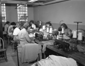 Inmates assembling shirts in the sewing room