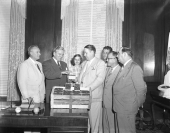 Governor Fuller Warren accepting strawberries from Florida growers