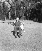 LeRoy Collins and Darby sharing a swing.