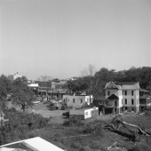 Two views of the demolition of homes surrounding the Capitol