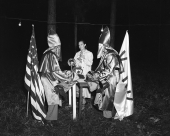 Ku Klux Klan officers in costume talking with the photographer's wife Sarah Catherine Kerce.