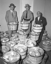 Governor Charley Johns with Christmas baskets
