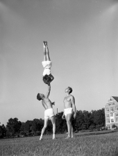 Gymnast Howard "Beans" Stephens holding up Nancy Lamb on the FSU campus.