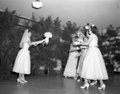 Patsy Clegg throwing her bridal bouquet.