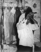 Woman at home combing her hair.