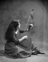 Portrait of musician Clair Kemper playing a theorbo - Tallahassee, Florida.
