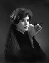 Portrait of Susan Mayo with a Siamese cat - Tallahassee, Florida.
