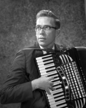 Portrait of Larry Bizennes with an accordion - Tallahassee, Florida.