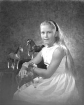 Portrait of Michelle Crutchfield with toy horses - Tallahassee, Florida.