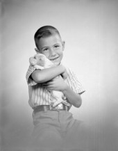 Portrait of the Martin family boy holding a puppy - Tallahassee, Florida.