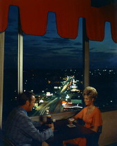 People having beverages in the Holiday Inn lounge overlooking Tennessee Street - Tallahassee, Florida.