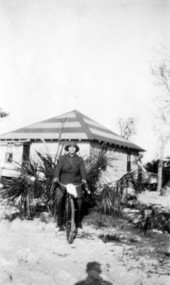 Florida State Board of Health nurse on a bicycle in Canal Point during a small flu outbreak.