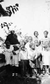 Group of African American children with caretakers.