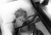 View showing a sick child in bed.