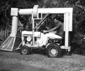 View showing an International Harvester Company "Cub Cadet" lawn tractor fitted with mosquito control equipment.