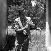 Unidentified man collecting sample to test the water supply in Florida.