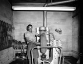 Unidentified employee repairing a tire - Tallahassee, Florida .
