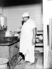 Camp cook preparing a meal - Wakulla County, Florida.