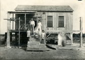 John Douthet family in front of residence