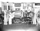 Woman's club display on baby products.