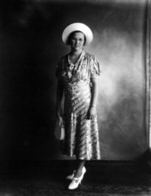 Woman wearing hat.