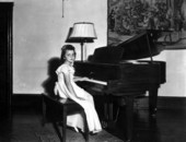 Miss Grunsly at the piano.