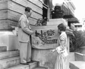 Jim Merrill and girl holding the City of Jacksonville flag.
