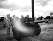 Railroad stewardesses/nurses and soldiers with field cannon.